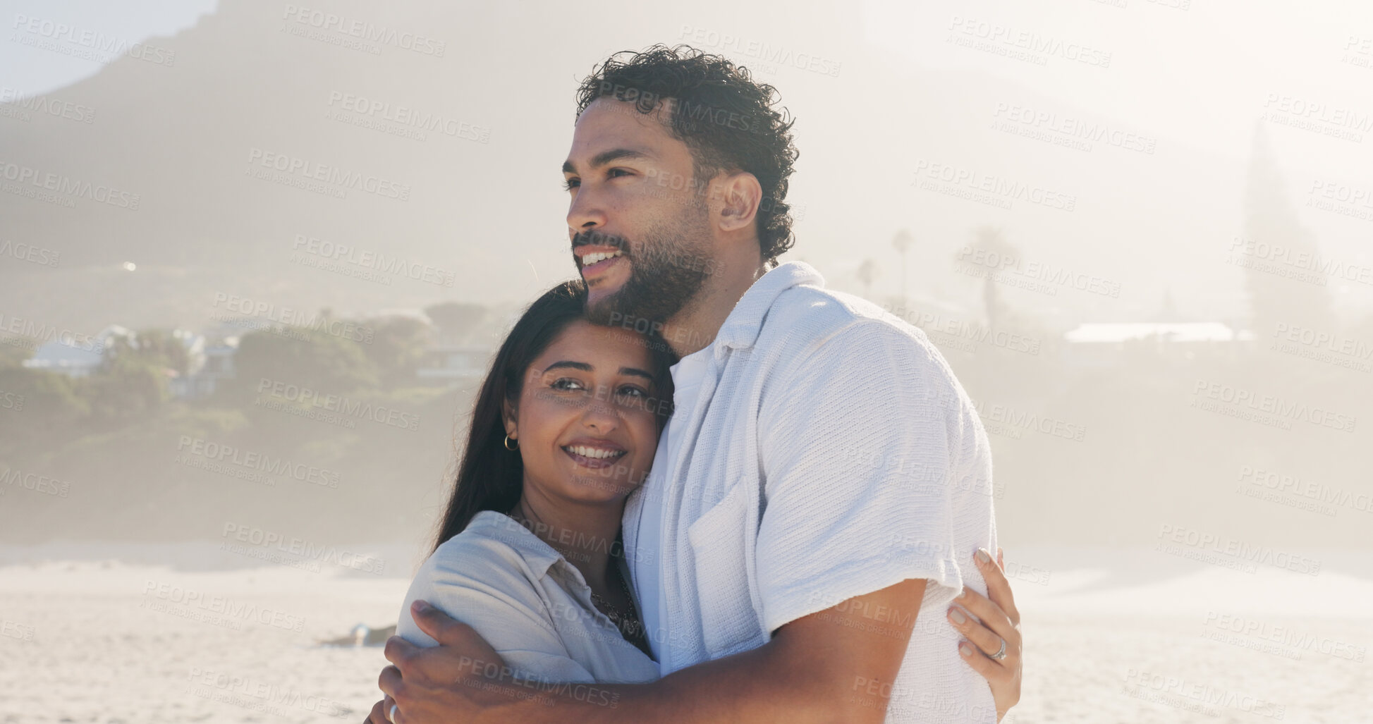 Buy stock photo Hug, smile and thinking with couple on beach together for anniversary, date or honeymoon in summer. Holiday, love and vision with happy people embracing outdoor for bonding, travel or vacation