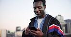 Black man, phone and texting in city for smile with sky, space and check notification for chat. African person, happy and smartphone in urban town with online dating, gen z style and streetwear