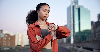 Buy stock photo Woman, fitness and smart watch with timer in city for break, monitor or check heart rate on bridge. Gen z girl, runner and stopwatch with iot clock, rest and app with for exercise in urban town