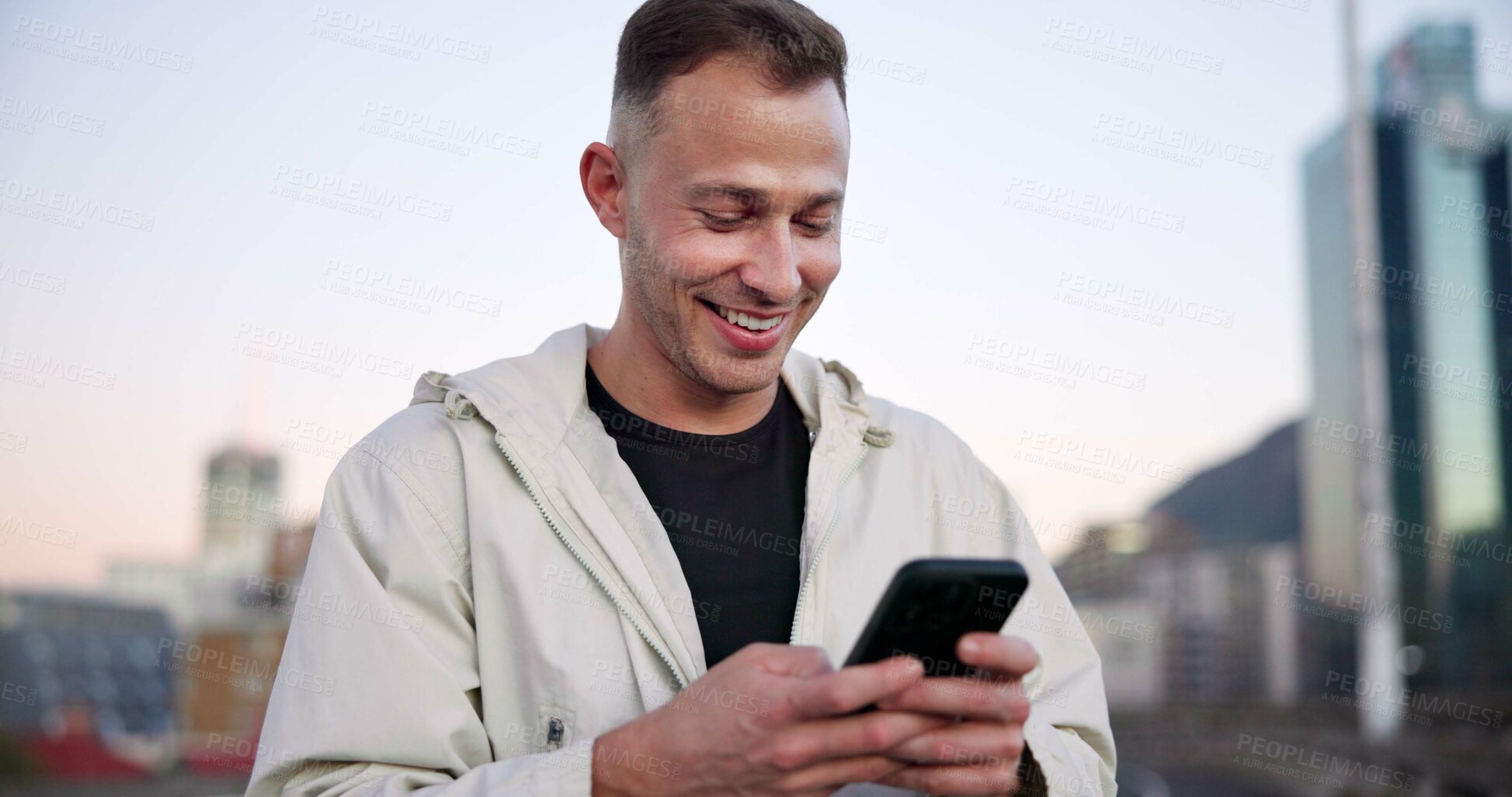 Buy stock photo Man, phone and fitness in city with smile for break, texting and check notification on application. Person, happy and smartphone for rest in urban town for exercise, outdoor or scroll on bridge