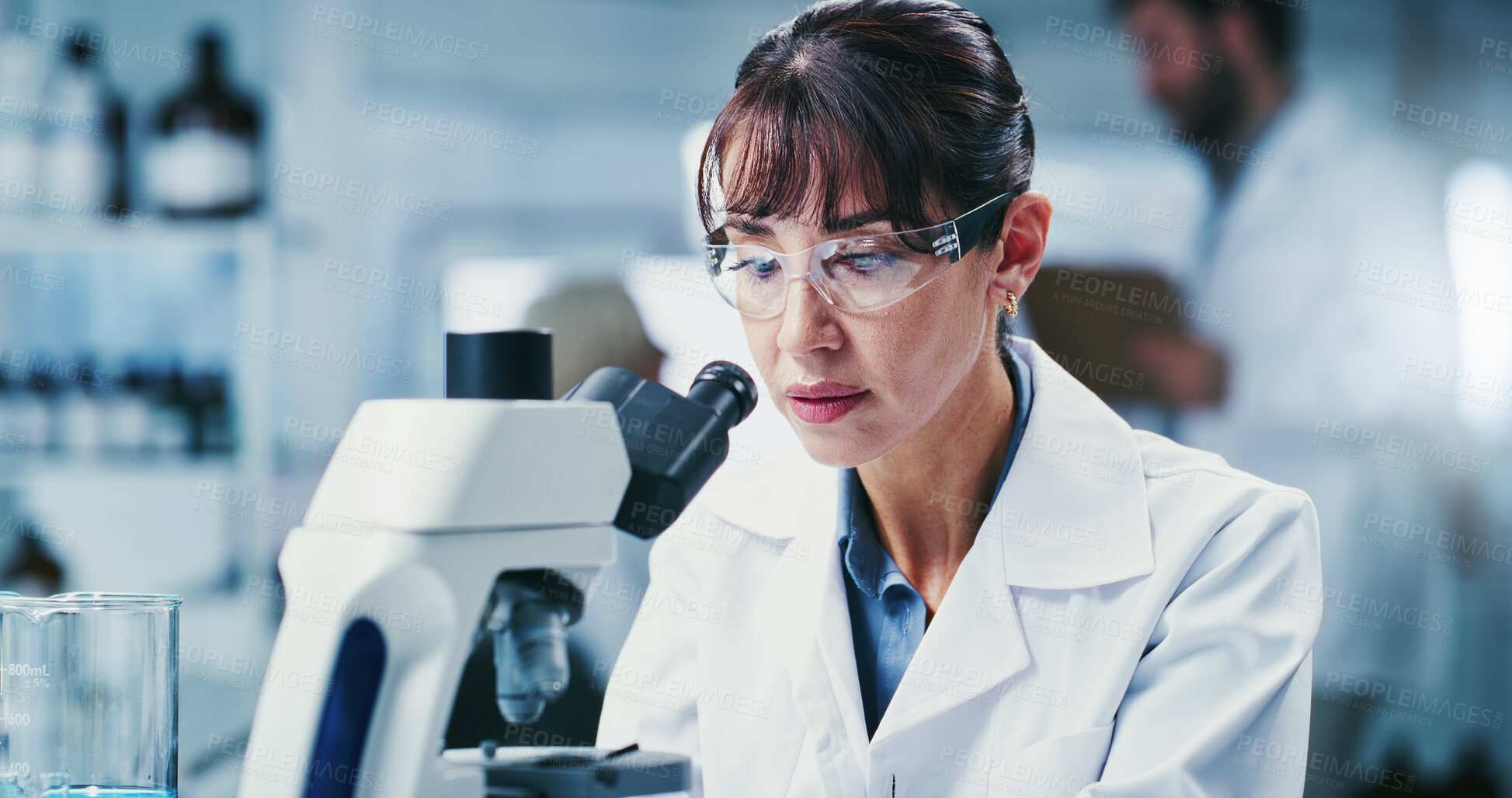 Buy stock photo Science, goggles or woman in lab with microscope, test or examination in biochemistry. Clinical research, glasses or mature scientist with equipment, medical analysis or inspection in rna development