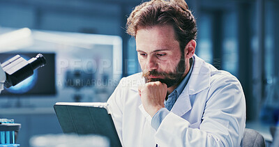 Buy stock photo Science, review or man with tablet in lab, online research article or pathology trial study for info. Experiment results, reading or scientist with vaccine development news, medical journal or tech