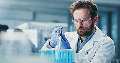 Buy stock photo Serious, scientist and man with pipette, lab and drug development for metabolic disease and research. Healthcare worker, glasses and person with liquid, innovation and medical study for diabetes cure