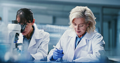 Buy stock photo Science, people and experiment in lab with microscope, pathology and investigation for medical research. Mature women, teamwork and scientist in clinic with biotech, sample test and healthcare trial.
