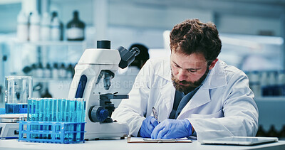 Buy stock photo Microscope, science and writing with man in laboratory for development or research results. App, notes and solution with scientist person at work on clinical trial, medical study or pharmaceuticals