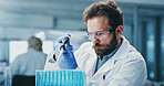 Scientist, research and man with pipette, lab and drug development for metabolic disease and biotech. Healthcare worker, glasses and person with liquid, innovation and medical study for diabetes cure