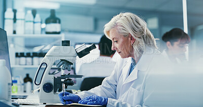 Buy stock photo Scientist, woman and writing in lab with notebook, experiment results or info for medical research. Coworking, mature person and notes in clinic with science investigation, healthcare study or report