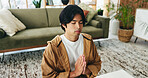 Zen, man and meditation with prayer in lounge, mindfulness and calm with spiritual awareness in home. Person, wellness and self care for mental health on break, relax or healing with yoga and balance