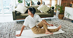 Man, headphones and yoga in home with streaming, stretching and meditation music on floor in lounge. Person, audio and listen with subscription service for mindfulness with holistic fitness in house
