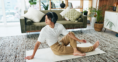 Buy stock photo Man, headphones and yoga in home with streaming, stretching and meditation music on floor in lounge. Person, audio and listen with subscription service for mindfulness with holistic fitness in house