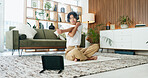 Stretching, tablet and yoga with man on floor in home living room for exercise or wellness routine. App, fitness and headphones with Asian person in apartment for online class, streaming or tutorial