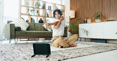 Buy stock photo Stretching, tablet and yoga with man on floor in home living room for exercise or wellness routine. App, fitness and headphones with Asian person in apartment for online class, streaming or tutorial