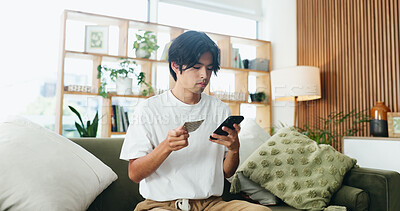 Buy stock photo Man, phone and pills on couch with search for side effects, ingredients or allergies on web at home. Person, smartphone and check medicine on mobile app, supplements and drugs for wellness in house