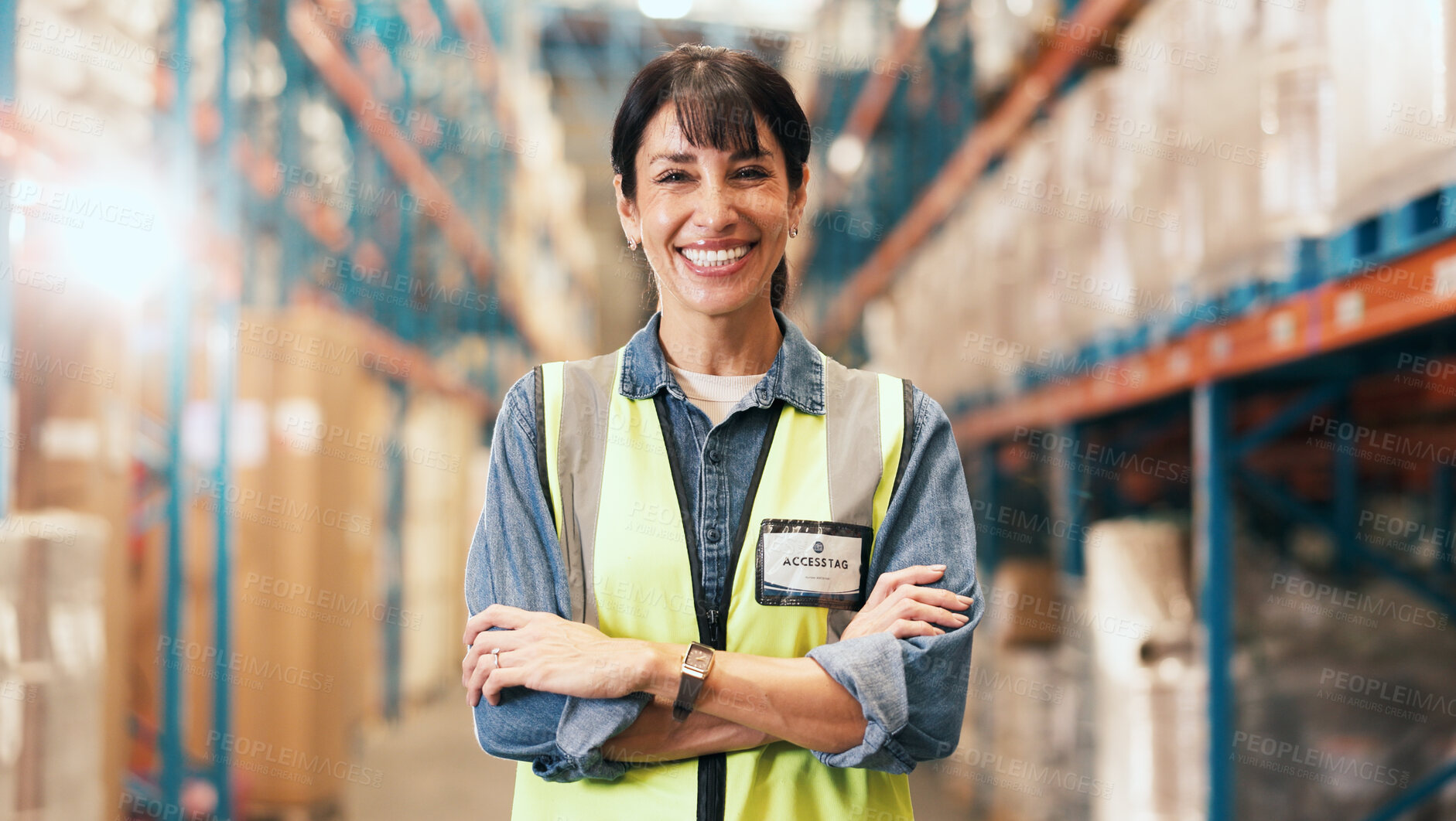 Buy stock photo Happy woman, portrait and logistics with confidence in warehouse for storage or shipping service. Mature, female person or distributor with smile or arms crossed for supply chain or freight in depot