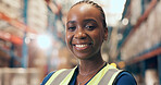 Black woman, portrait and logistics with confidence in warehouse for storage or shipping service. Happy, female person or distributor with smile for supply chain, security or freight safety in depot