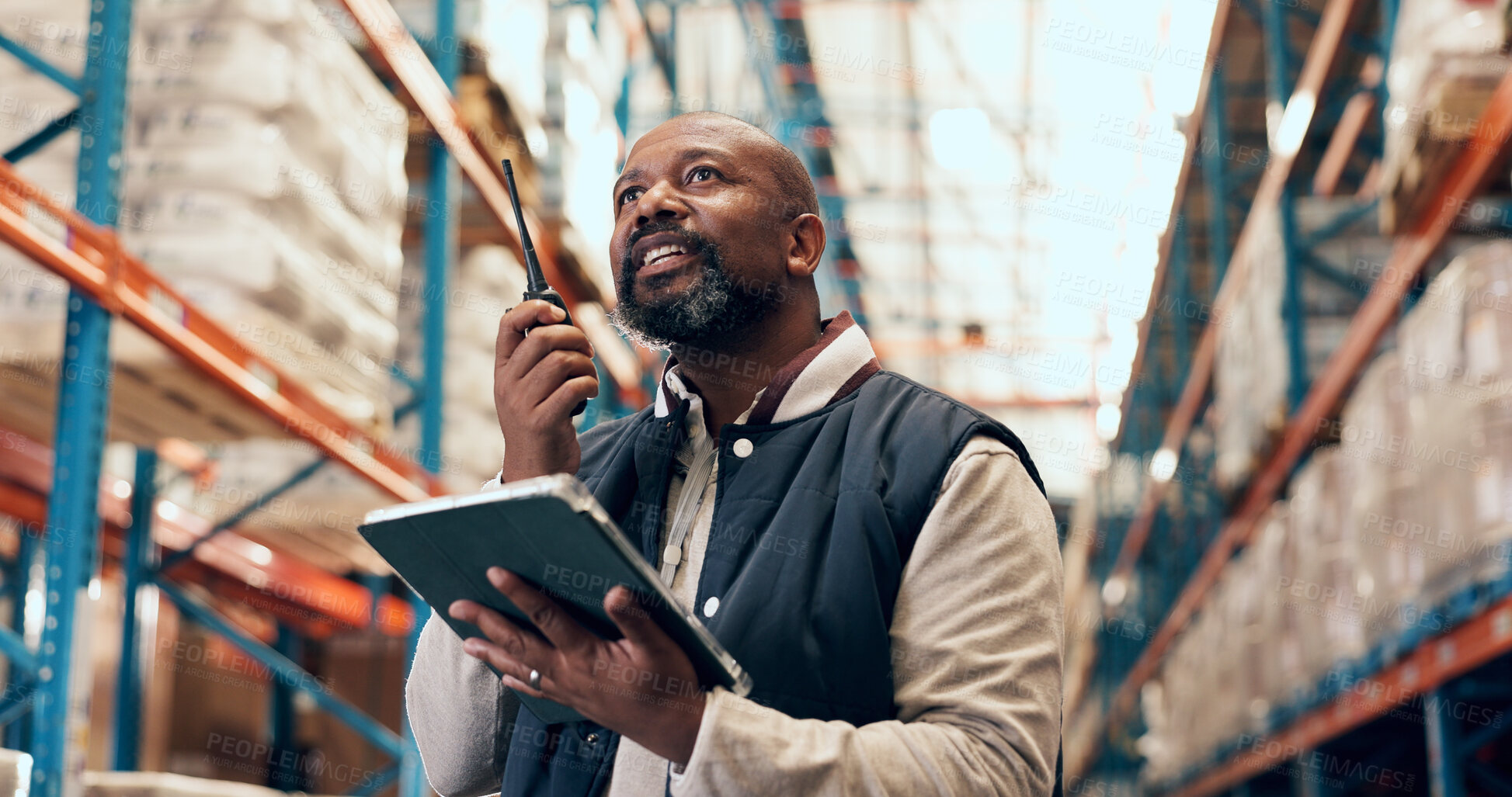 Buy stock photo Radio, talking and black man on tablet in warehouse for inspection, online inventory and delivery. Supervisor, low angle and mature person on tech with contact for logistics, shipping or distribution