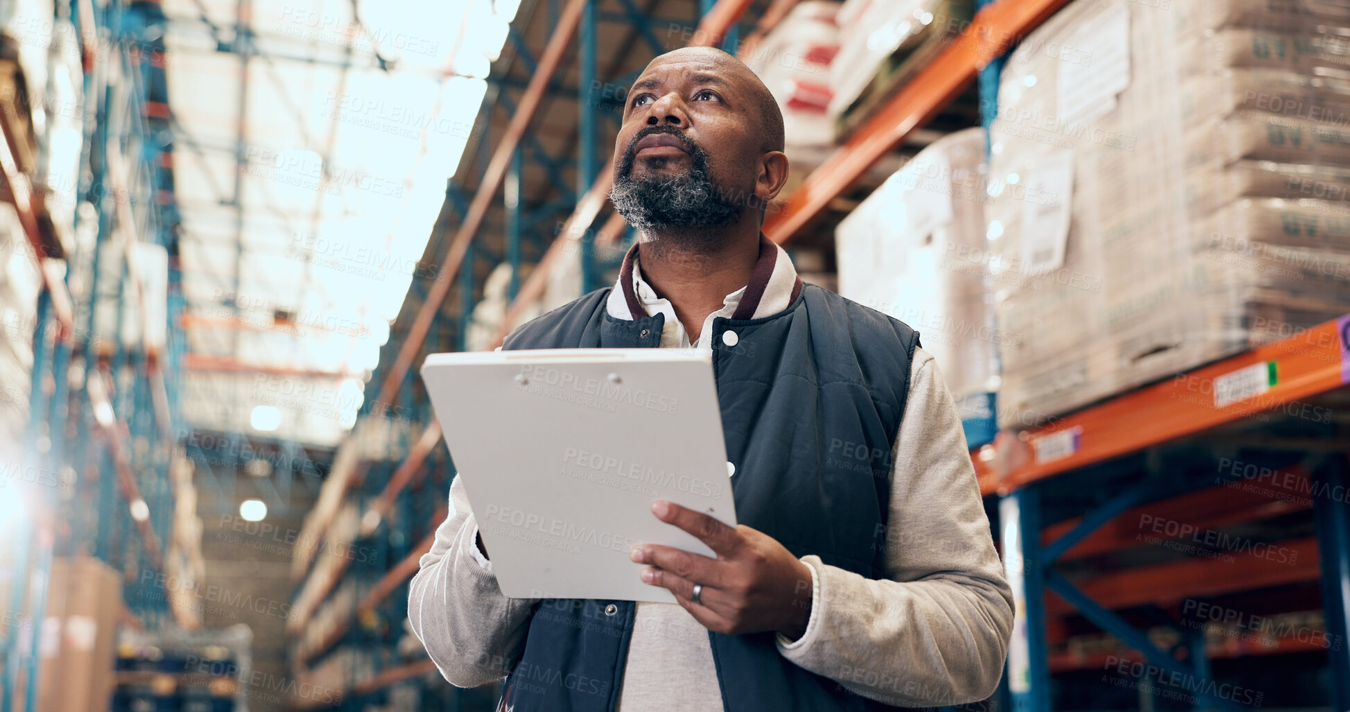 Buy stock photo Black man, logistics and inspection with clipboard for inventory checklist or stock control in depot. Mature, male person or employee checking shipping with list for supply chain or freight business