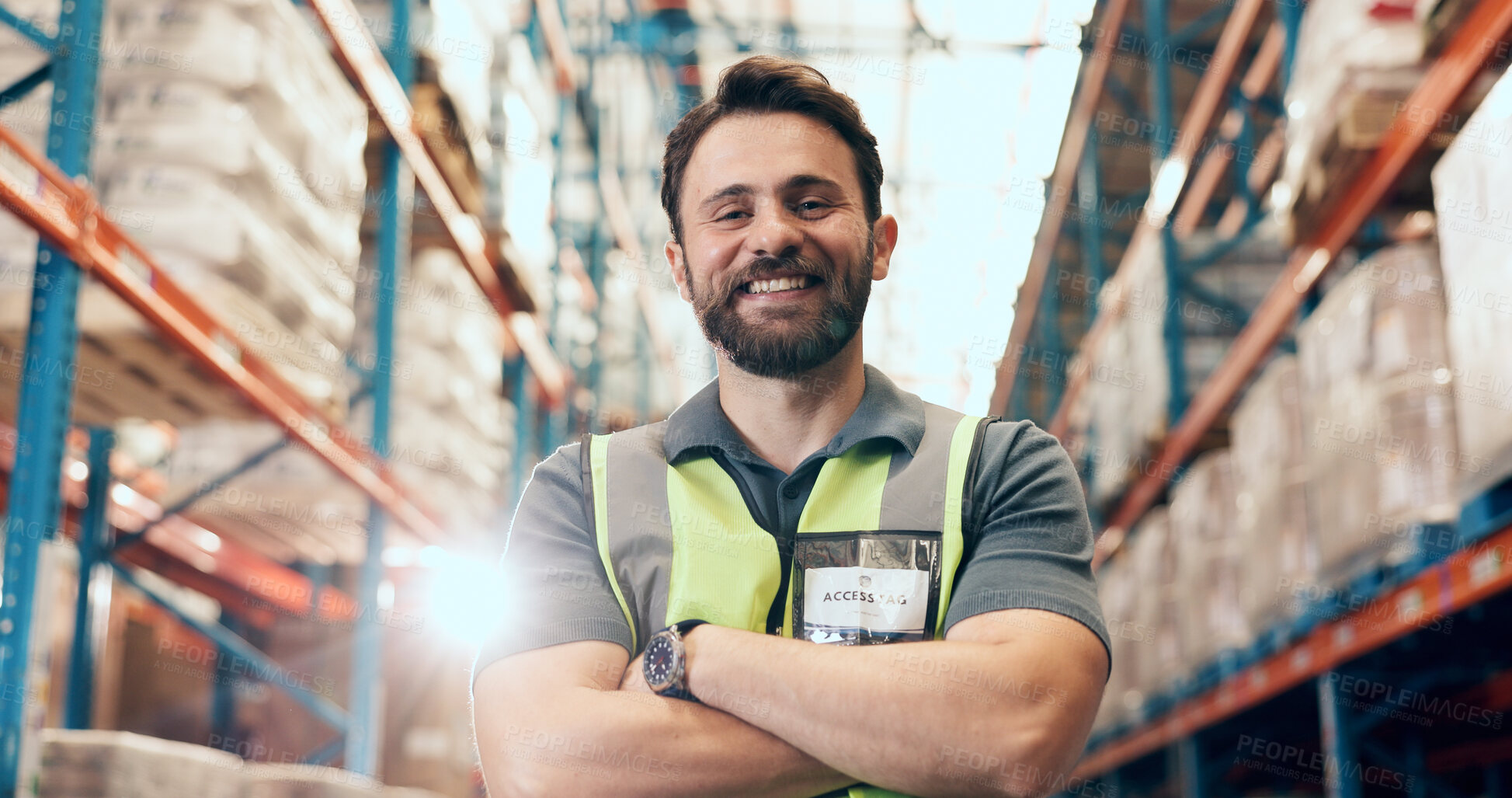 Buy stock photo Happy man, portrait and logistics with confidence in warehouse for storage or shipping service. Flare, male person or distributor with smile or arms crossed for supply chain or freight in depot