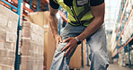 Logistics, hands and employee with knee pain in factory, distribution and loader with muscle tension. Shipping, stock and person with leg injury, inflammation and work accident in warehouse or strain