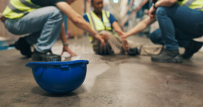 Buy stock photo Warehouse, helmet and employee with injury on floor, workplace accident and assistance for coworker. Shipping, loader and person with muscle tension, supply chain or safety risk after slip in factory