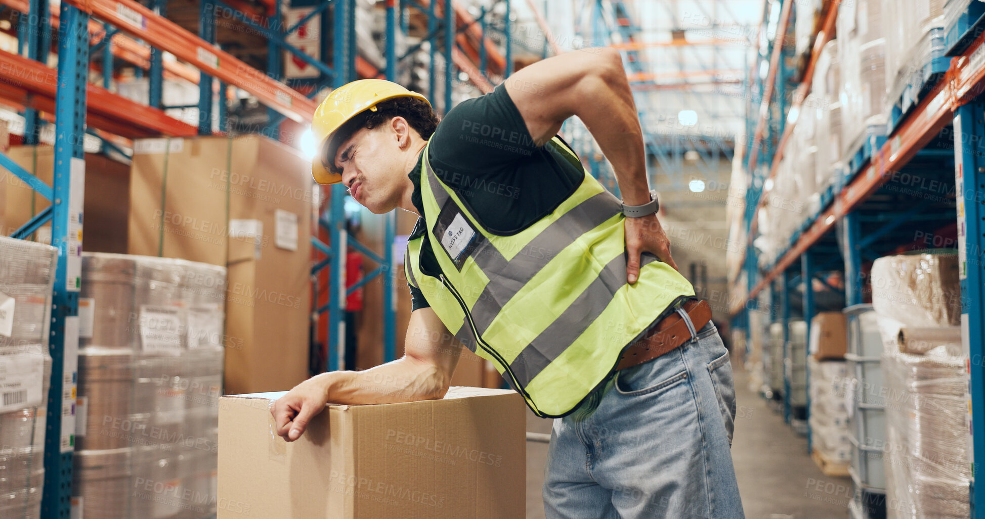 Buy stock photo Logistics, loader and man with backache in warehouse, injury and stock distribution or supply chain. Shipping, joint pain and person with muscle tension, workplace accident and safety risk in factory