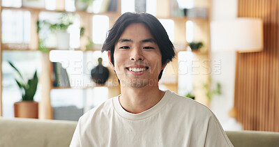 Buy stock photo Comfortable, portrait and smile of Asian man on sofa in home living room for weekend break as student. Confidence, me time and relax with college or university pupil on apartment couch in Japan