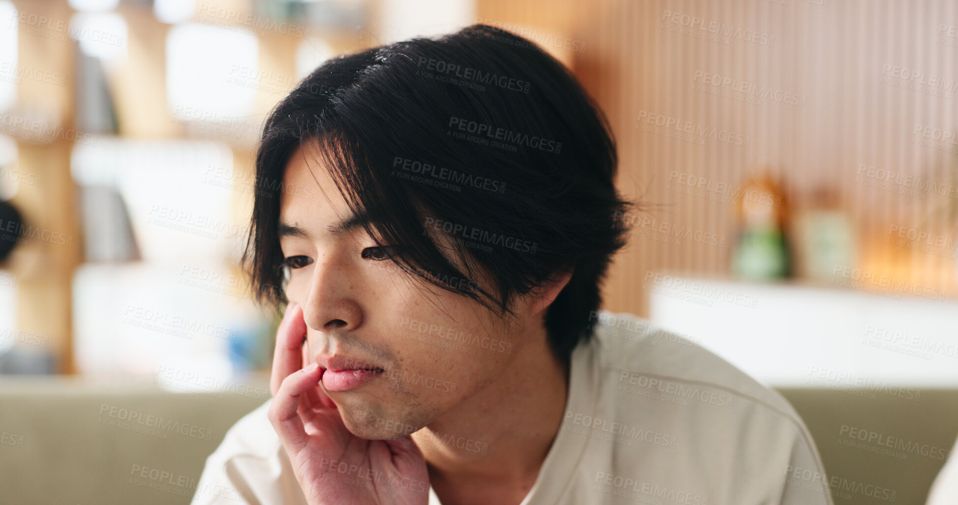 Buy stock photo Uncertain, sad and man on sofa in home with regret for decision or choice with mental health. Anxiety, thinking and Asian male person with reflection for mistake, failure or bad news in living room.