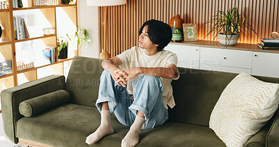 Buy stock photo Man, relax and vision with Asian student on sofa in home living room for morning or weekend break. Comfortable, planning and thinking with college or university pupil in apartment for education ideas