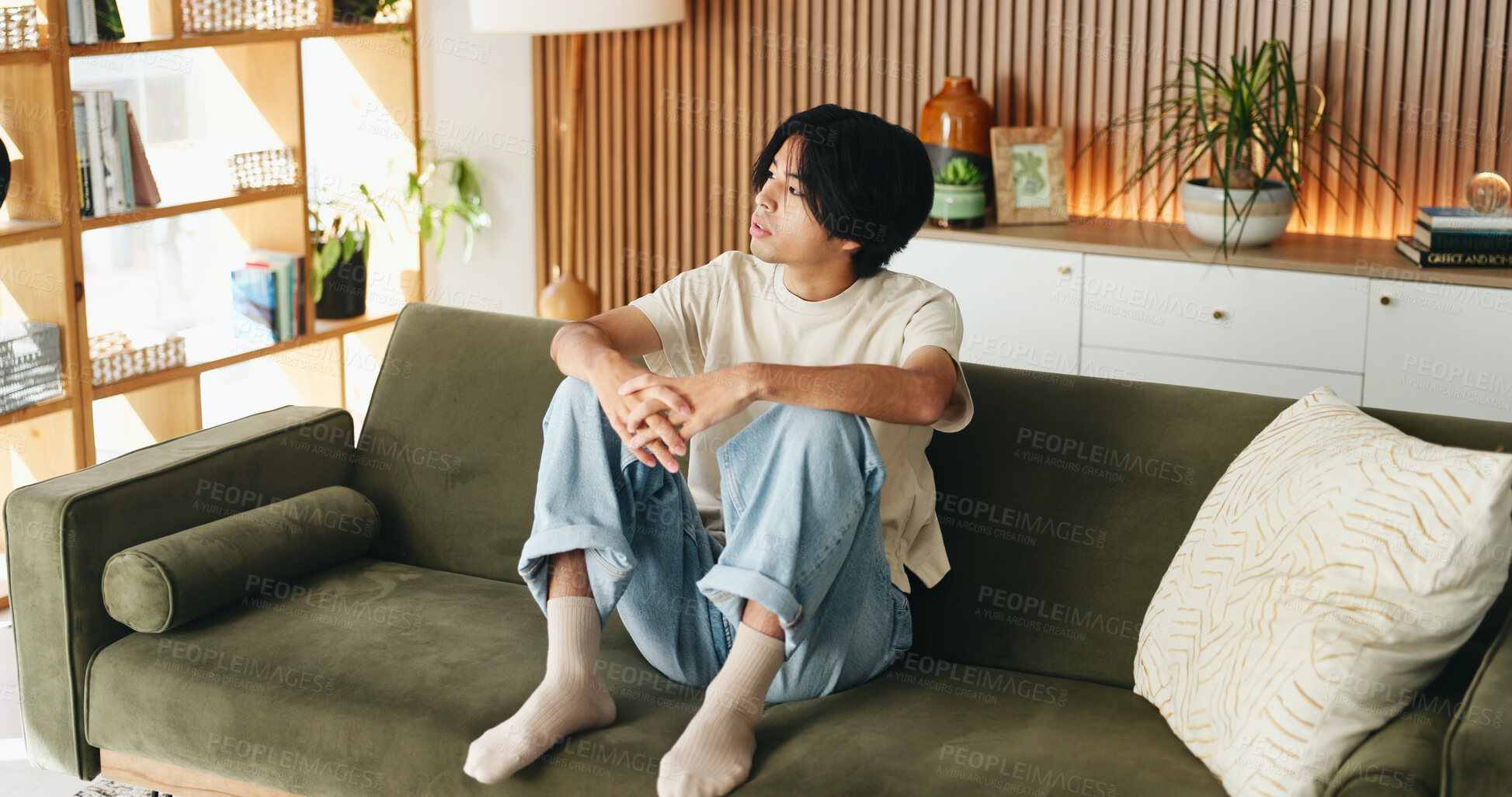 Buy stock photo Man, relax and vision with Asian student on sofa in home living room for morning or weekend break. Comfortable, planning and thinking with college or university pupil in apartment for education ideas