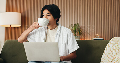 Buy stock photo Coffee, laptop and man on sofa in house with online application for university scholarship. Education, relax and Asian male student drinking warm beverage with computer for studying in living room.