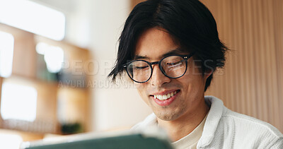 Buy stock photo Glasses, smile and tablet with Asian man in home living room or online education or research. App, distance learning and eyewear with happy university student in apartment for development or growth
