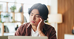 Man, headache and remote work in home with laptop, fake news and risk of bad reputation for writer. Tired, Asian person and freelancer in house with computer, migraine or negative review for article.
