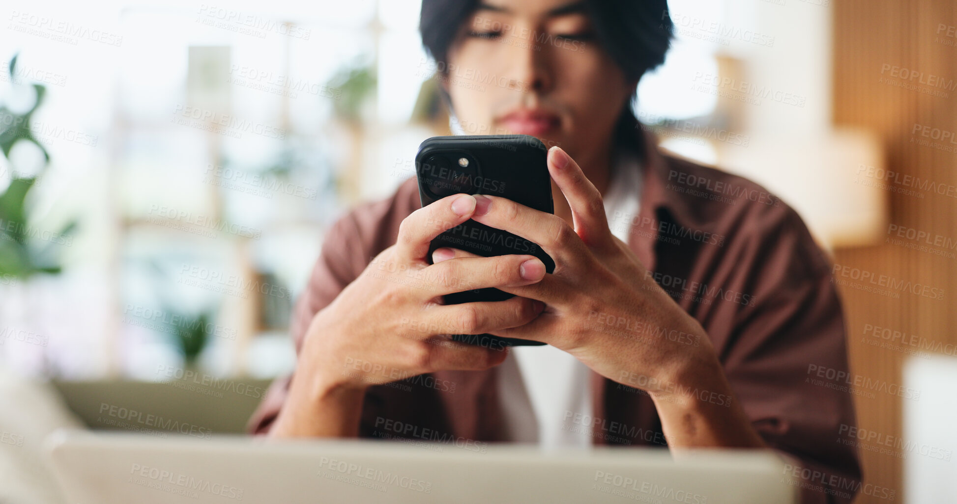 Buy stock photo Text, scroll and hands in house with phone, internet search and communication on online platform. Browse, digital and Asian man in home with tech, social media update and message on virtual app.