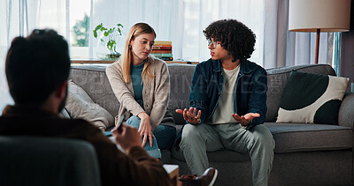 Buy stock photo Listen, couple and talking to psychologist in therapy for marriage trust, accountability and healing. Counseling, interracial people and conflict resolution with doctor for help, advice and solution
