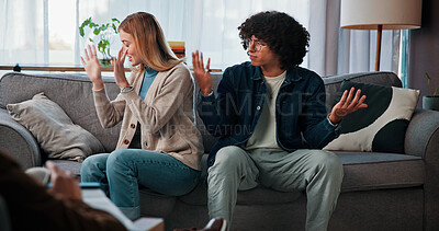 Buy stock photo Psychology, couple and fight in counseling on sofa for infidelity, toxic relationship and broken trust. Divorce, angry and interracial people with conflict in therapy for betrayal, cheating or crisis