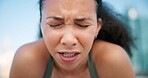 Runner, breathe and face of woman in city for break from exercise, workout and training. Sports, fatigue and person in town for rest, challenge and fitness for active hobby, wellness and health