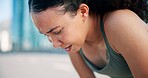 Runner, tired and woman with sweat in city for break from exercise, workout and training. Sports, fatigue and person in town for rest, challenge and fitness for active hobby, wellness and health