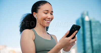 Buy stock photo Fitness, phone and woman in city with earphones for music, tracking exercise or mobile app. Sports, runner and person on smartphone for workout goals, training and active hobby with audio for health