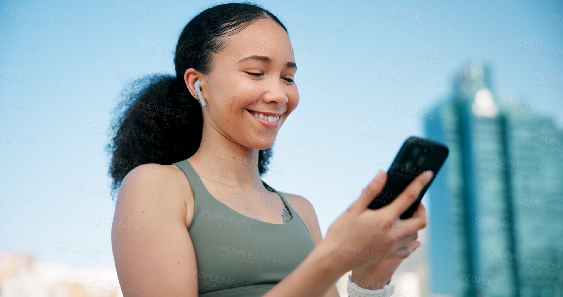 Buy stock photo Fitness, phone and woman in city with earphones for music, tracking exercise or mobile app. Sports, runner and person on smartphone for workout goals, training and active hobby with audio for health