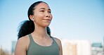 Runner, thinking and woman with earphones in city on break for exercise, workout and training. Sports, space and person in town for rest, music and fitness for active hobby, wellness and health