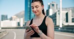 Runner, phone and woman in city with earphones for music, tracking exercise or mobile app. Sports, fitness and person on smartphone for workout goals, training and active hobby for health or wellness