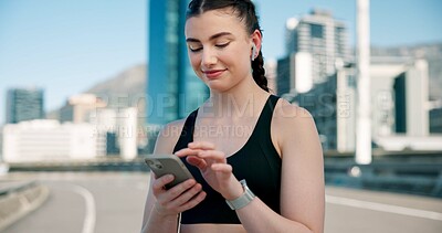 Buy stock photo Runner, phone and woman in city with earphones for music, tracking exercise and mobile app. Sports, health and person on smartphone for workout goals, fitness and active hobby with audio or playlist 