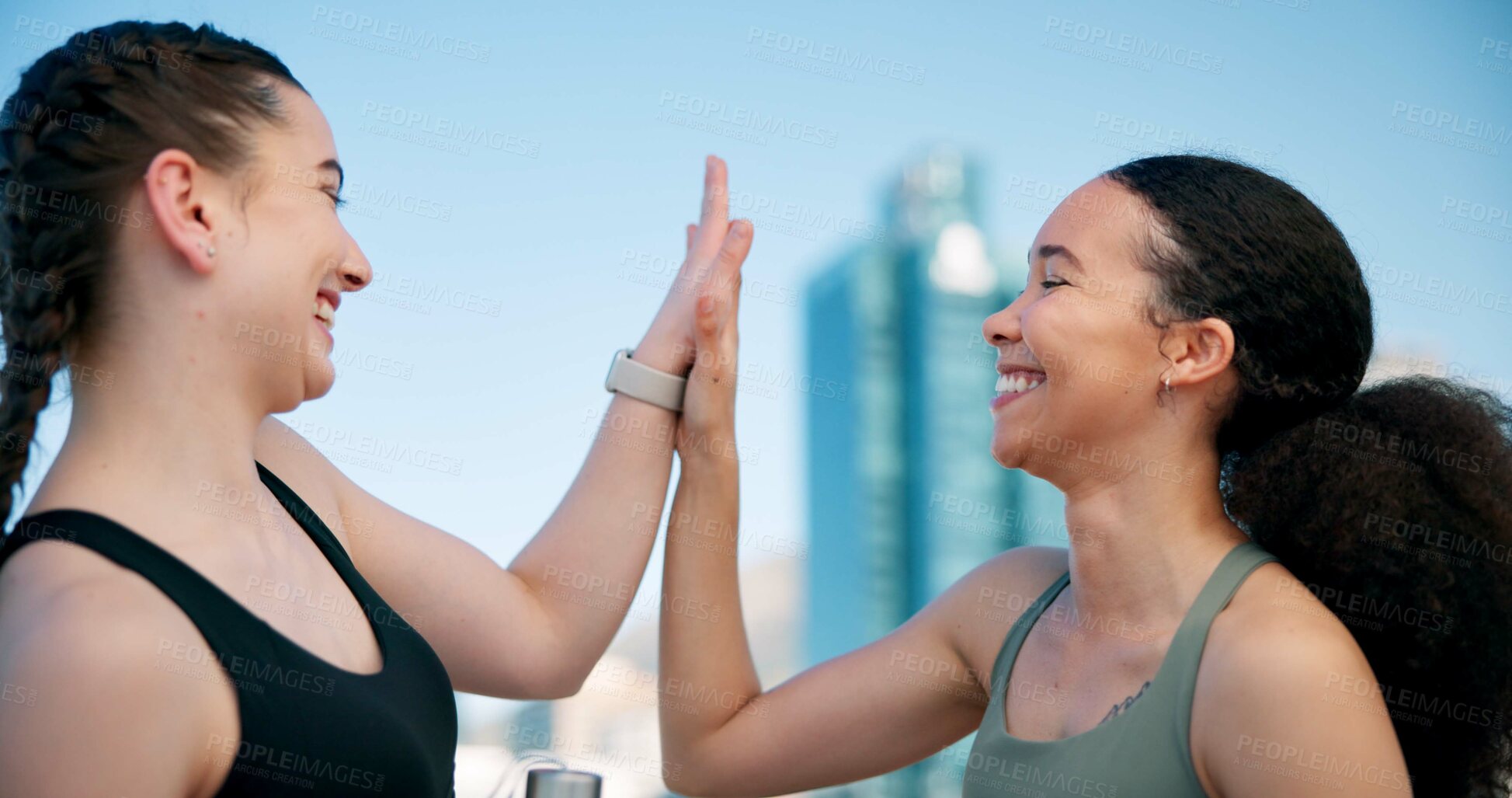 Buy stock photo Runner, happy and women high five in city for exercise, workout and training together. Sports, smile and friends with goals in town for success, break and fitness for active hobby, wellness or health