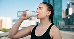 Woman, fitness or drinking with water bottle for hydration, sustainability or thirst in city. Active, female person or runner with mineral liquid or beverage for break, rest or recovery in urban town