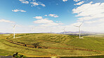 Farm, wind turbine and clean energy outdoor in nature, sustainability or eco friendly in environment. Aerial view, windmill and natural power plant with zero emissions, space or renewable electricity