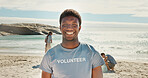 Smile, man and portrait of volunteer on beach with confidence for social responsibility. Happy, NGO and male charity worker by ocean for community service with earth day project by sea conservation.