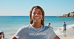 Smile, woman and portrait of volunteer on beach with confidence for social responsibility. Happy, NGO and female charity worker by ocean for community service with earth day project by seaside.