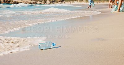 Buy stock photo Litter, pollution and trash with plastic bottle on beach for habitat conservation or sustainability. Ocean, sand and space with people on coast with for cleaning, recycling or waste management