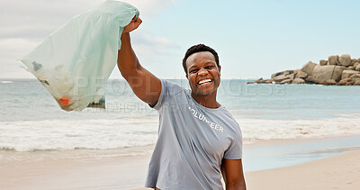 Buy stock photo Portrait, seaside and black man with trash bag, volunteer for social responsibility and sustainability. Beach, clean environment or happy person with plastic collection, excited to recycle or ecology