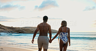 Buy stock photo Couple, holding hands and laughing on beach holiday, relax and together on summer adventure or date. Back, black people and affection for partner at sea, love and outdoor for anniversary and romance